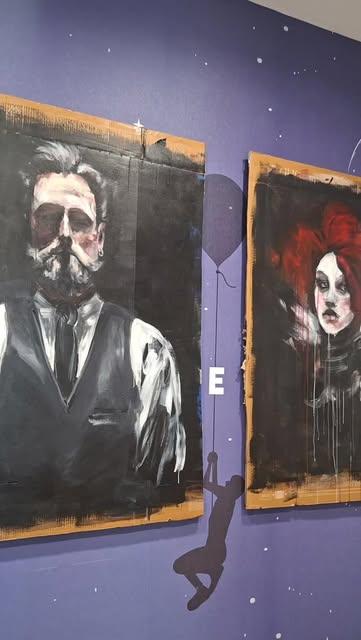 Cardboard portraits by Sara Lev Flam at an exhibition