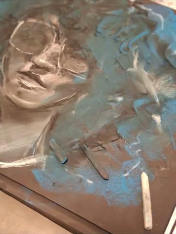 Pastel portrait in progress on cardboard
